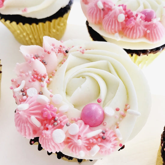 Sweet LuLu's Chocolate Cupcakes with White Buttercream and Pink Star Piping and Pink Sprinkles